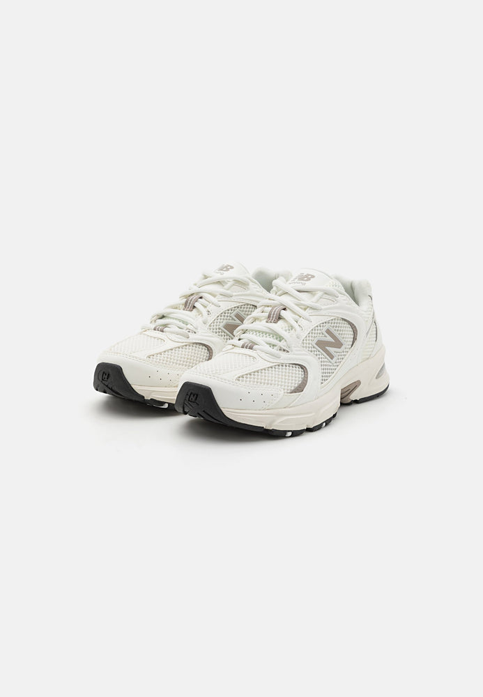 New Balance 530 Sneaker White Beige side view featuring a clean and comfortable design.