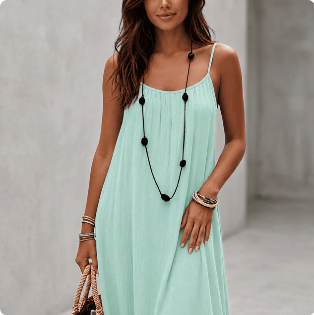 Woman wearing a Backless Loose Home Long Dress in mint green, showcasing a relaxed and stylish look.