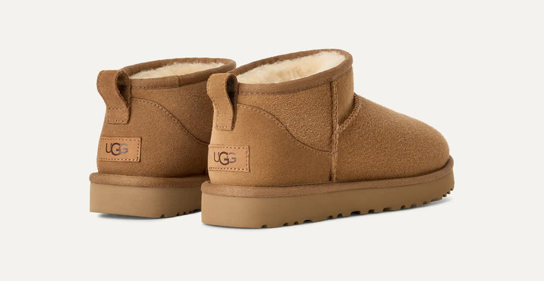 Pair of tan UGG boots on a white background in volonka store. UGG Classic Ultra Mini Women's Warm Wool Snow Boots