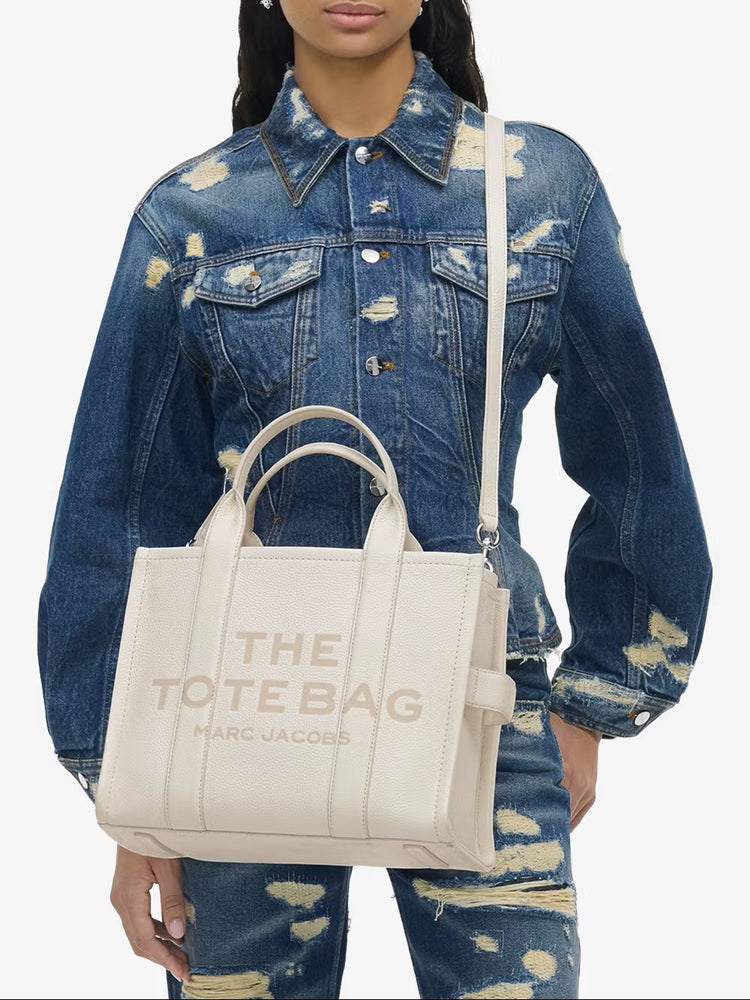 Marc Jacobs Shopper Tote Bag Leather White displayed, showcasing its elegant design and craftsmanship at Volonka.