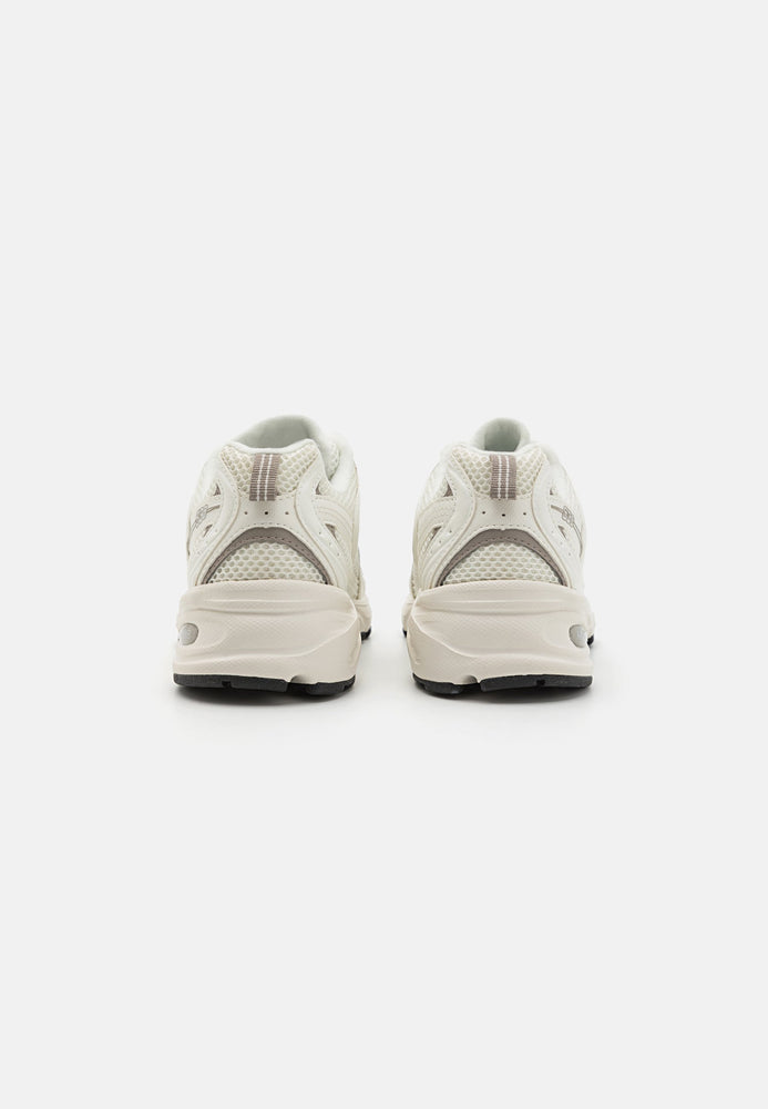 New Balance 530 Sneaker White Beige side view featuring a clean and comfortable design.