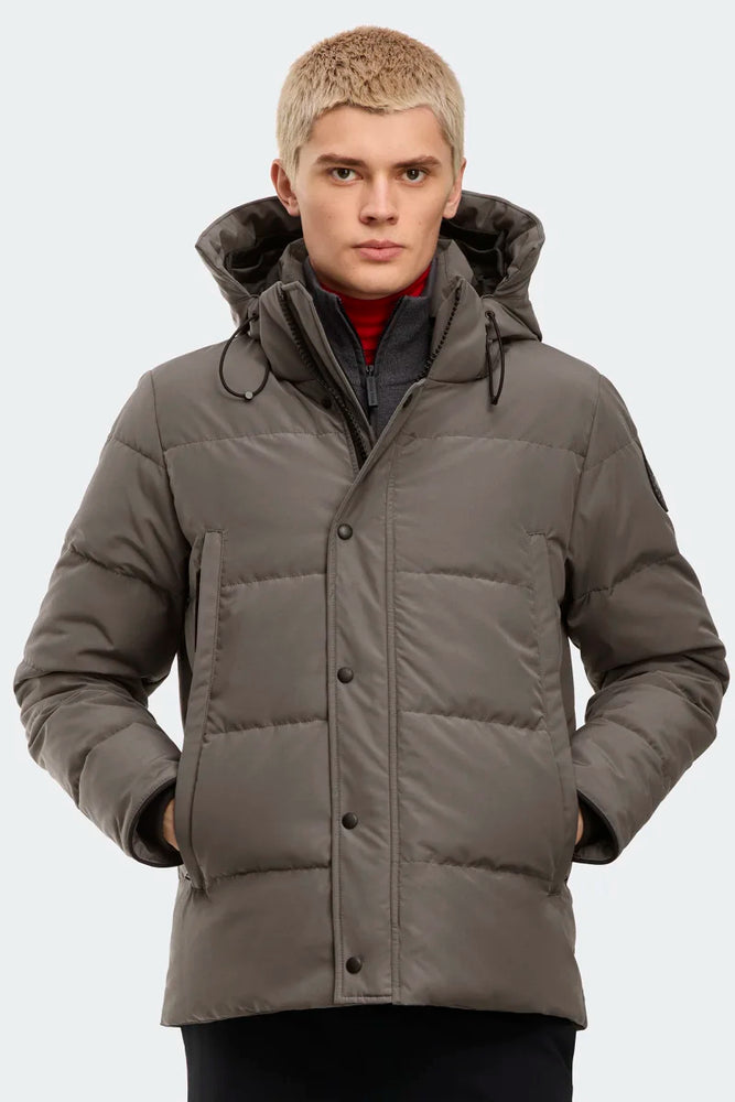 Man wearing a gray winter coat with a hood, Canada Goose Wyndham Parka Goose Men's Winter Jacket at Volonka.