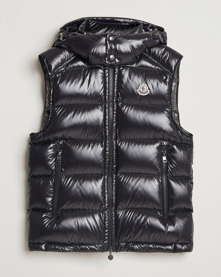 Moncler unisex Bormes down vest jacket. Black puffer vest with a brand logo on a light gray background