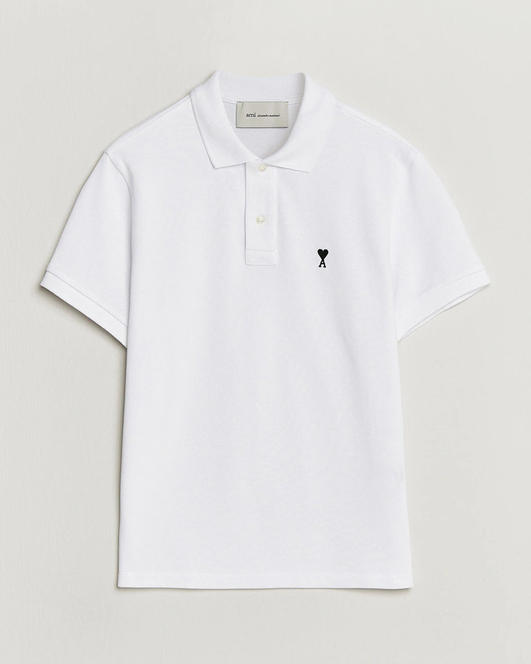 AMI Paris Heart Logo Men Polo Shirt in white featuring a signature heart logo on the chest.