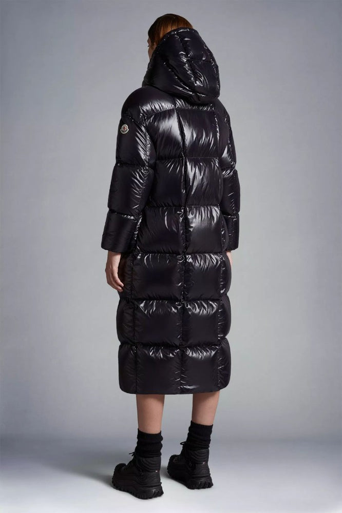 Person wearing a long black puffer coat, Moncler Cavettaz Hooded Long Down Jacket