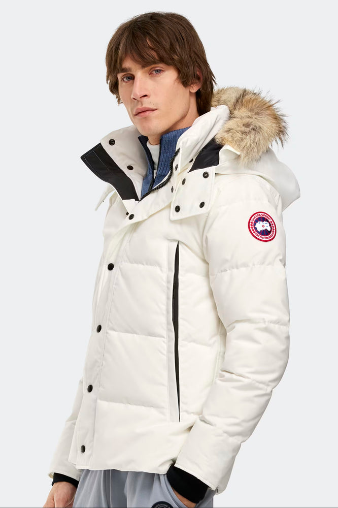 Man wearing Canada Goose Wyndham Parka Goose Men's Winter Jacket at Volonka. White Canada Goose jacket with fur hood.