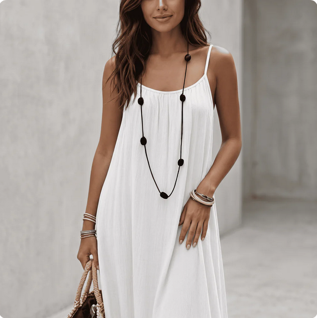 Woman wearing a Backless Loose Home Long Dress in white, showcasing a relaxed and stylish look.