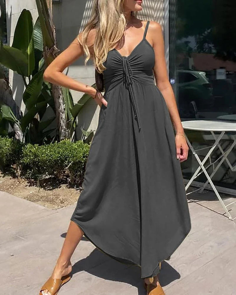 Woman wearing a black dress standing outdoors. Women's Summer Breathable Casual Jumpsuit