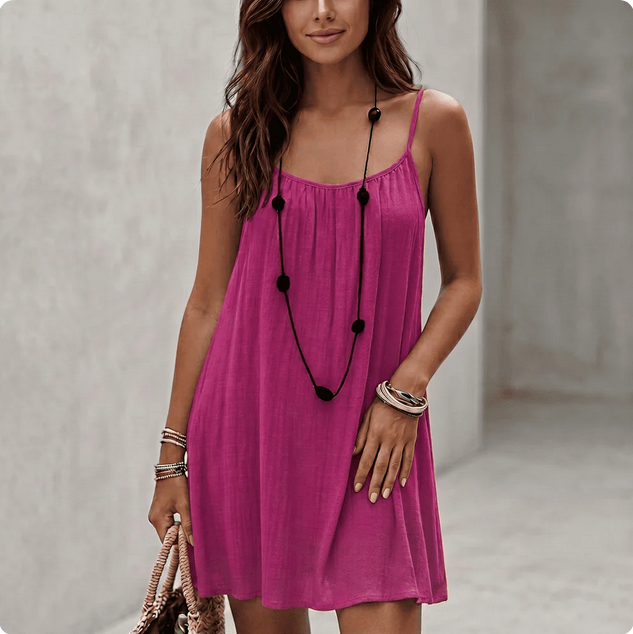 Backless Comfort Loose Short Dress displayed by a woman wearing a pink dress.