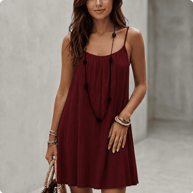 Backless Comfort Loose Short Dress displayed by a woman wearing a burgundy dress.