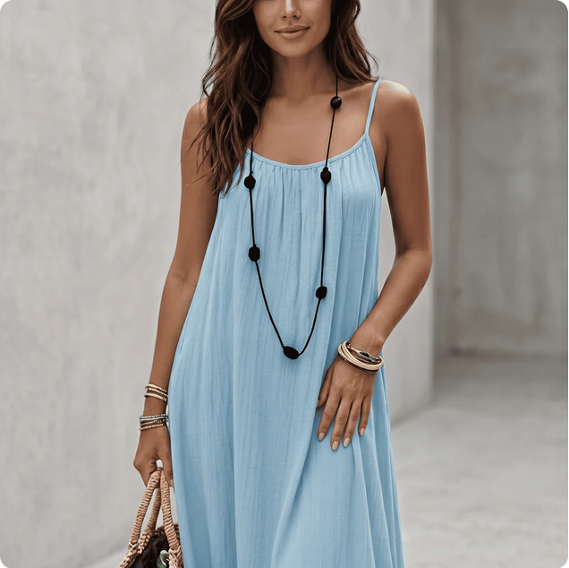 Woman wearing a Backless Loose Home Long Dress in light blue, showcasing a relaxed and stylish look.