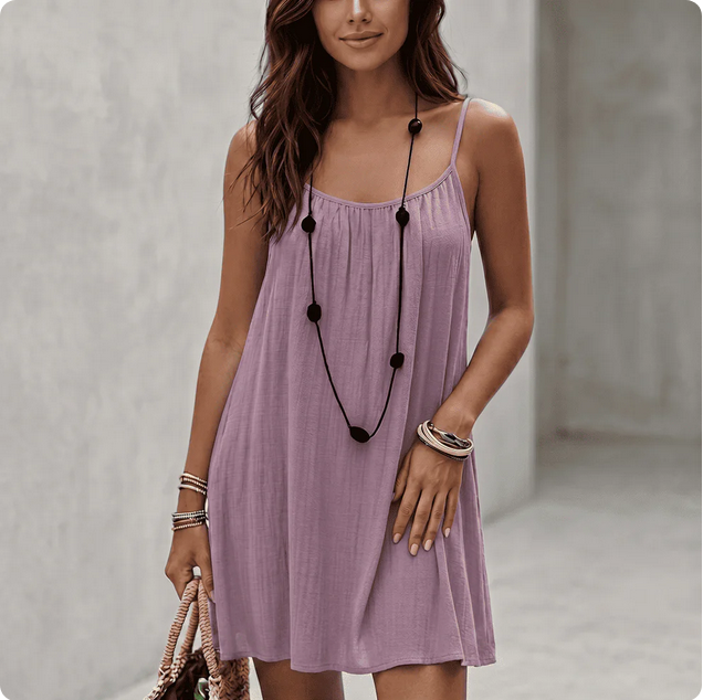 Backless Comfort Loose Short Dress displayed by a woman wearing a purple dress.