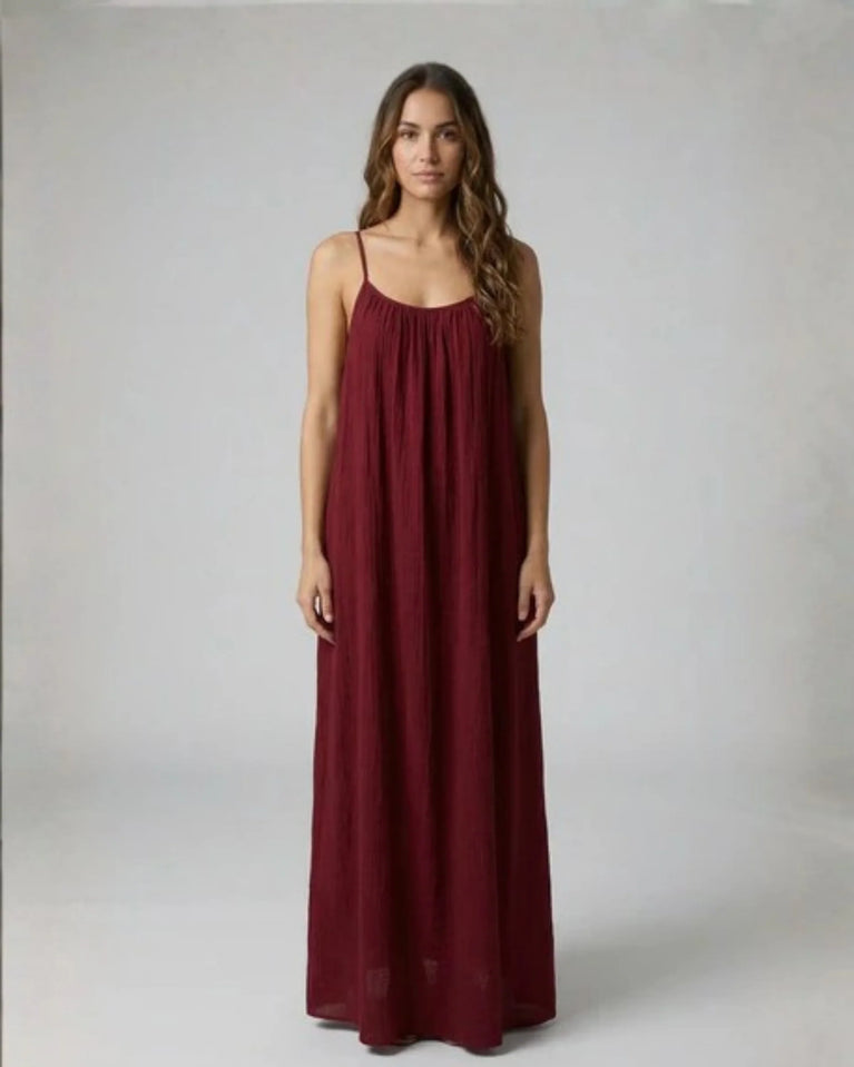 Woman wearing a Backless Loose Home Long Dress in burgandy, showcasing a relaxed and stylish look.