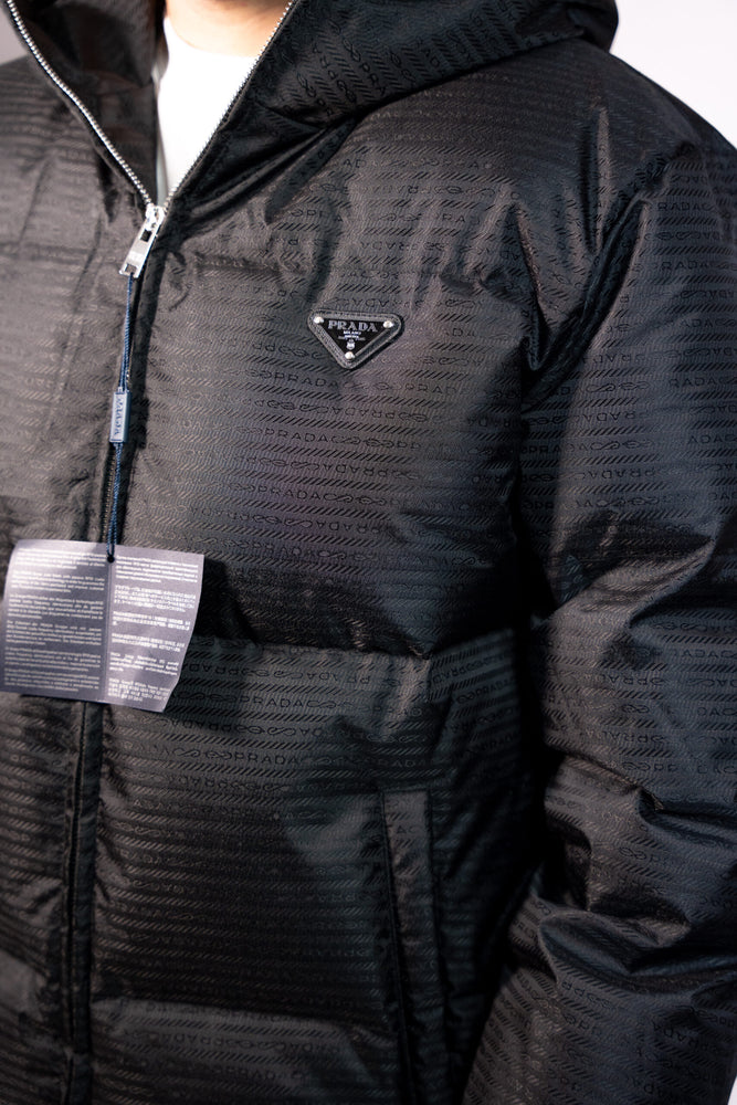Black jacket with a brand logo. Prada Puffer Down Jacket Unisex
