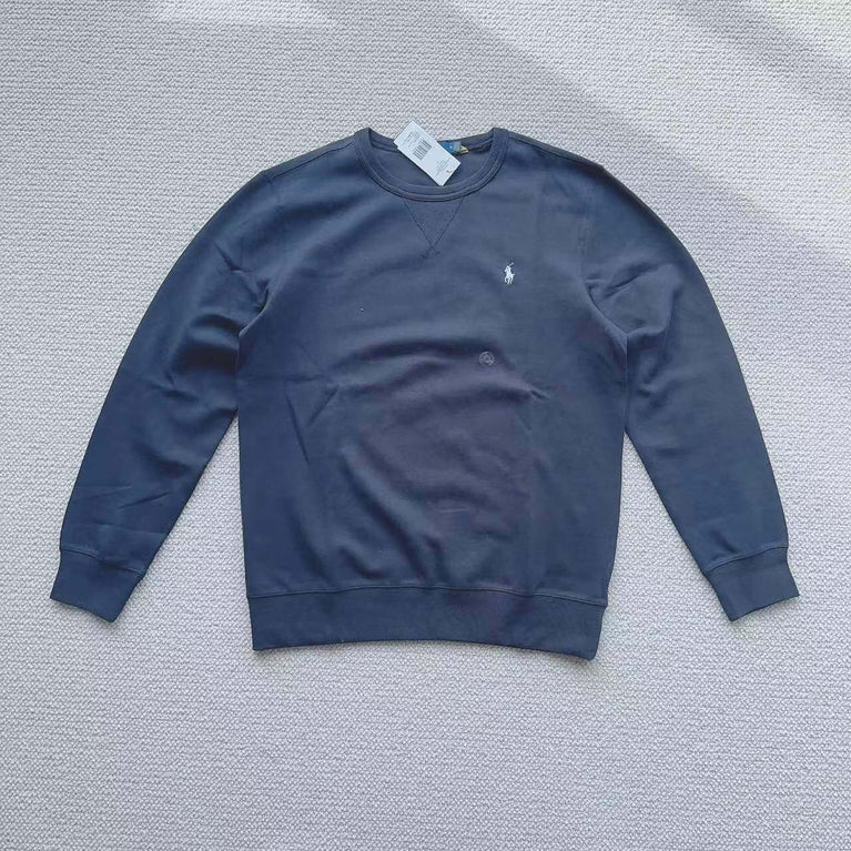 Navy blue Polo Ralph Lauren crew neck sweatshirt laid flat on white background