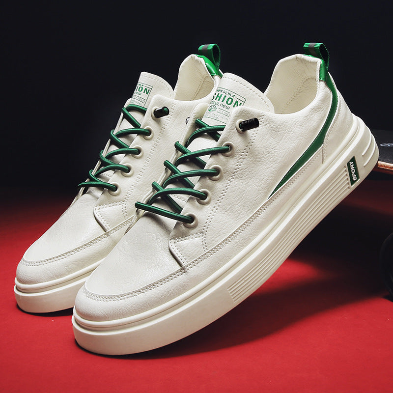 White sneakers with green laces on a red background