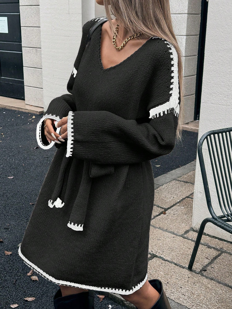 Woman wearing a black Womens Knit V-Neck Midi Dress Tie-Waist Loose Autumn Style at Volonka.