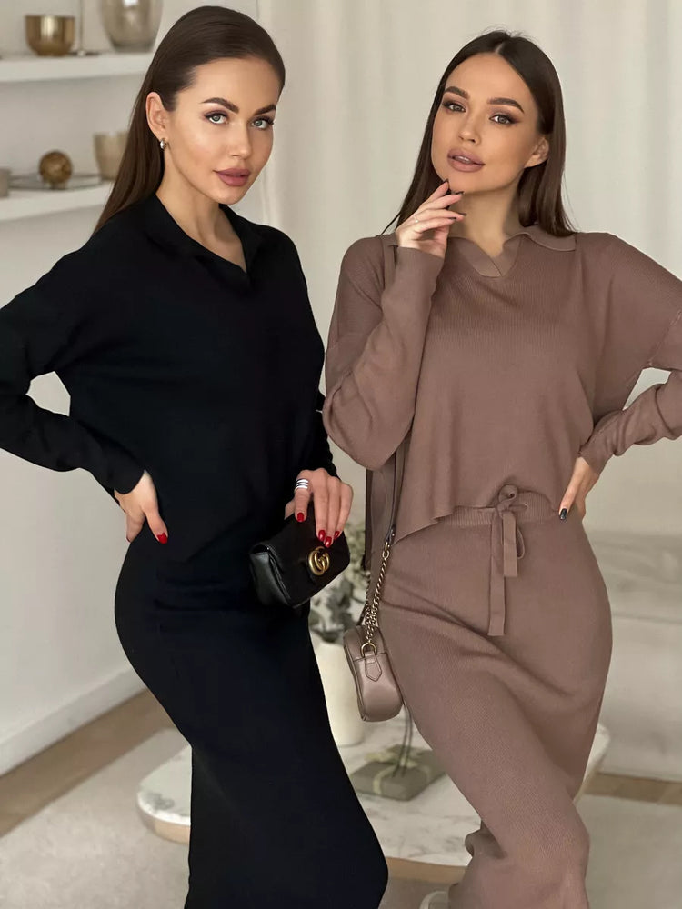 Two women wearing black and brown outfits standing indoors. Chic Elegant Soft Knit Sweater with Skirt Set at Volonka.