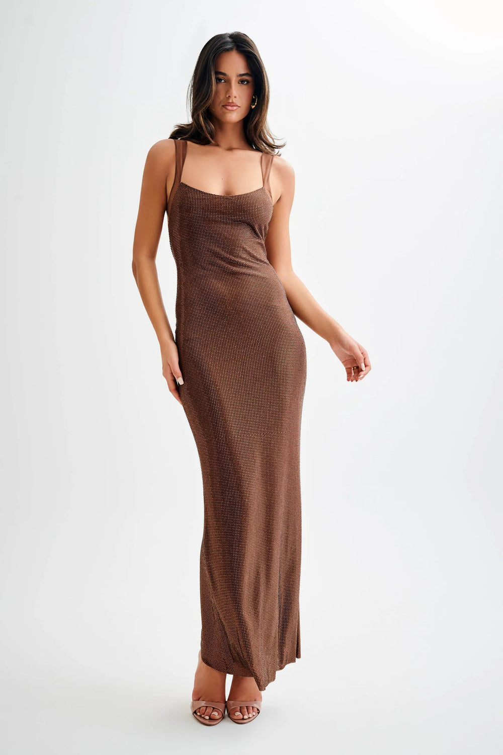 Elegant brown maxi dress featuring spaghetti straps, perfect for a stylish evening look.