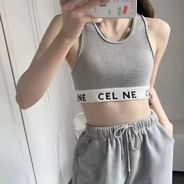 woman wearing a gray celine sports bra and matching pants with a visible brand logo. Celine original Bra In Athletic Knit in volonka store