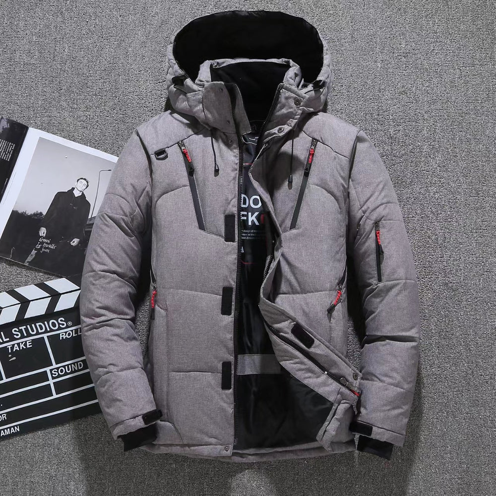 Gray winter puffer jacket with red zippers on a gray background. Men's High Quality Winter Warm Down Jacket