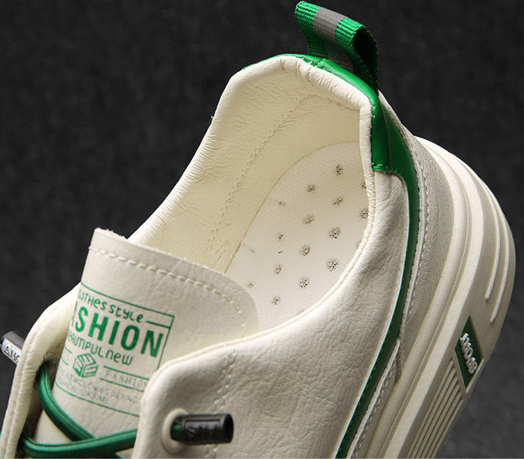 White shoe with green accents on a dark background