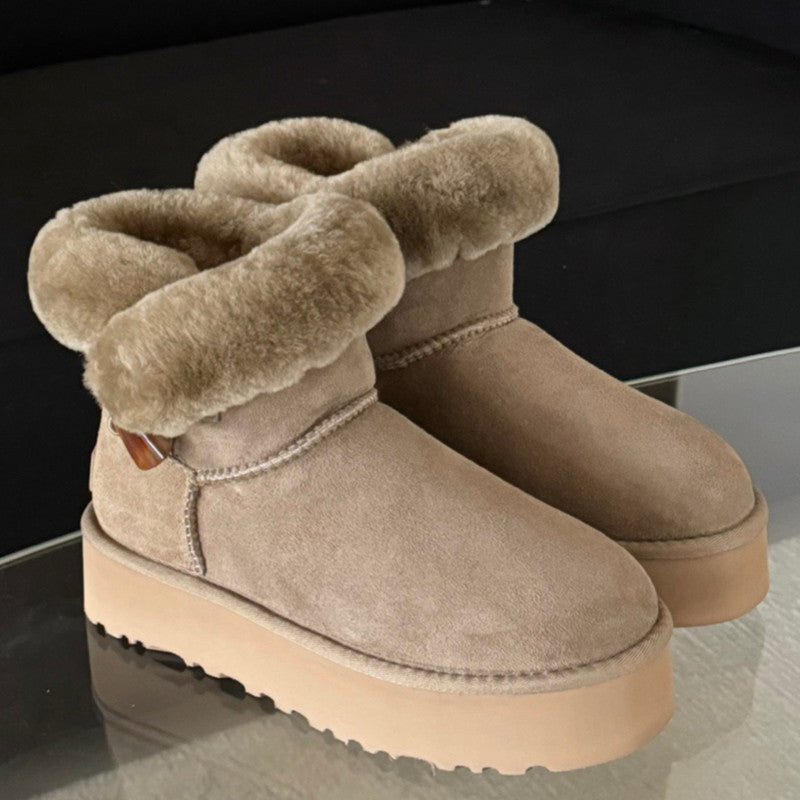 Pair of beige suede boots with fur. UGG Women's Winter Boots with Platform Sole at Volonka.