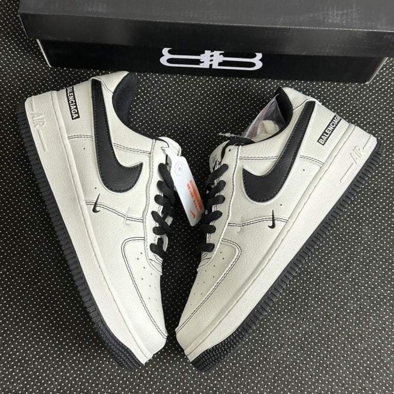 Nike Unisex F1 Air Force paris Low-top Casual Shoes. White sneakers with black swoosh logo on a textured surface