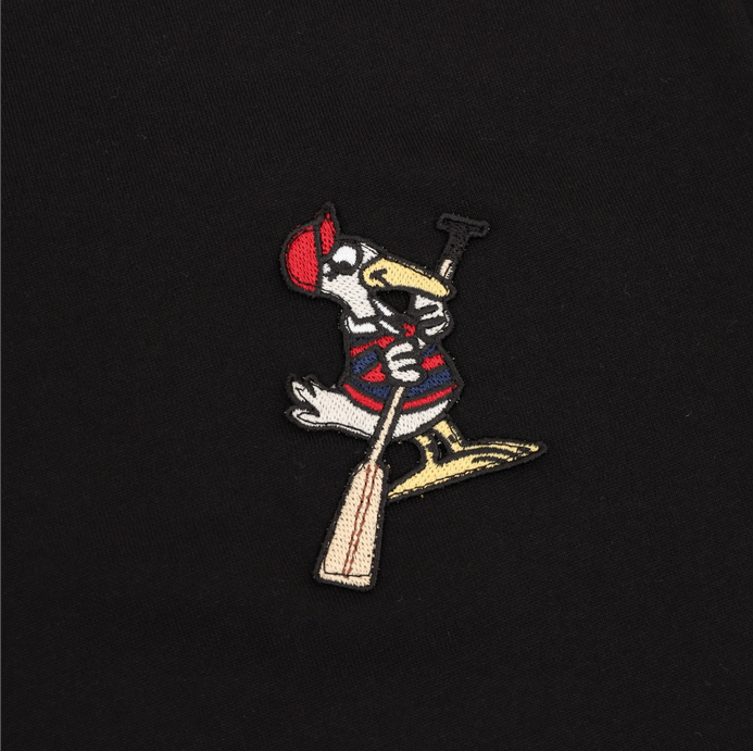 Moncler MC Duck Patchwork Tshirt featuring a playful design detail on a black background.