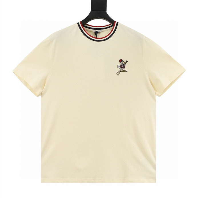 Moncler MC Duck Patchwork Tshirt featuring whimsical design and premium craftsmanship, displayed on a hanger.
