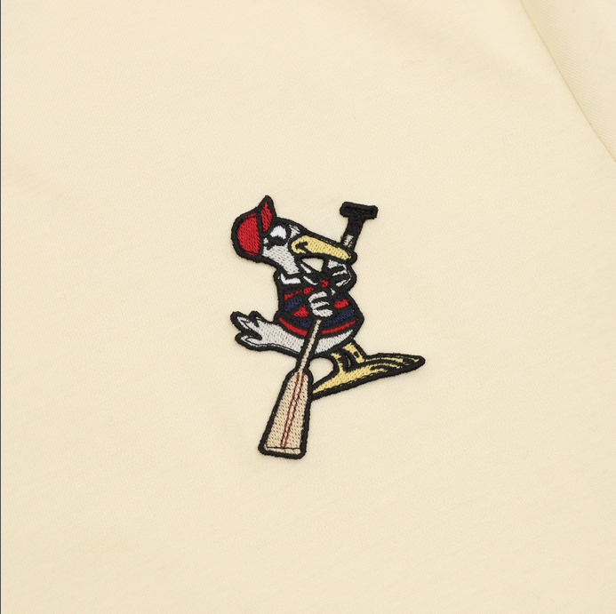 Moncler MC Duck Patchwork Tshirt featuring whimsical design and premium craftsmanship, displayed on a hanger.