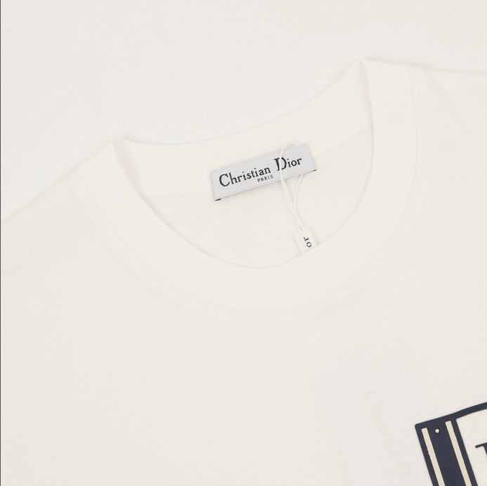 Dior Essential unisex Pocket Tshirt displayed on a hanger, showcasing its stylish white design.