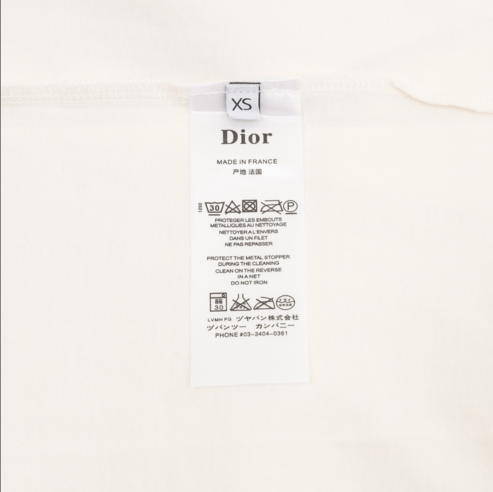 Dior Essential unisex Pocket Tshirt displayed on a hanger, showcasing its stylish white design.