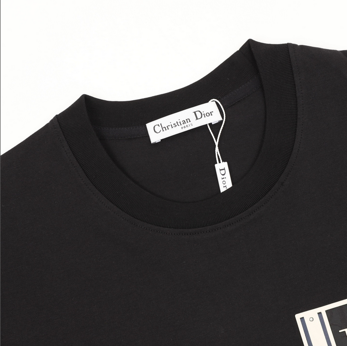 Dior Essential unisex Pocket Tshirt displayed on a hanger, showcasing its stylish black design.