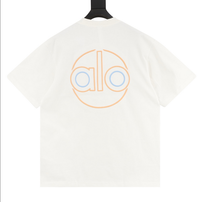 ALO Classic Minimal Short Sleeve Tshirt in white with logo on chest and red tag detail.