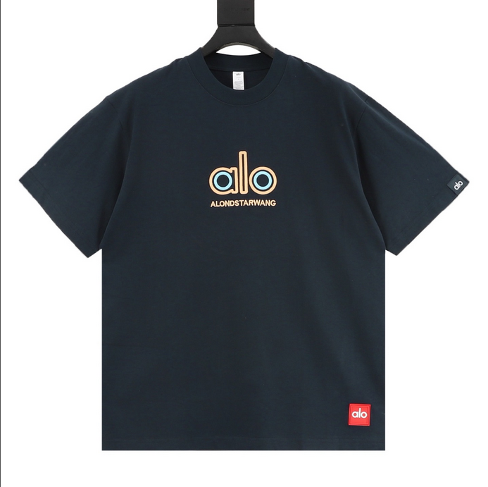 ALO Classic Minimal Short Sleeve Tshirt in navy blue with logo on chest and red tag detail.