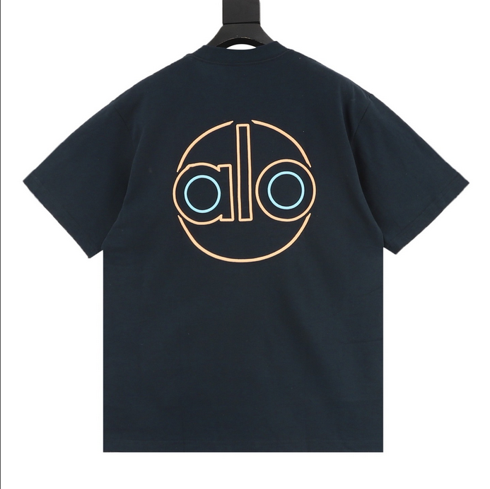 ALO Classic Minimal Short Sleeve Tshirt in navy blue with logo on chest and red tag detail.