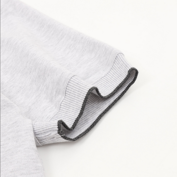 Brunello Cucinelli Men Polo Shirt displayed on a hanger in gray color.