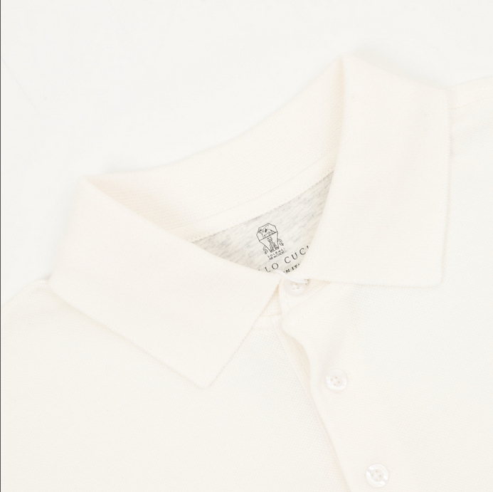 Brunello Cucinelli Men Polo Shirt displayed on a hanger in white color.
