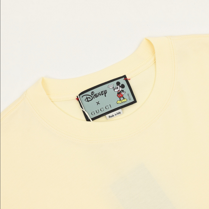 Gucci Disney Micky Mouse Milky Tshirt featuring Mickey Mouse design on a soft yellow oversized T-shirt.