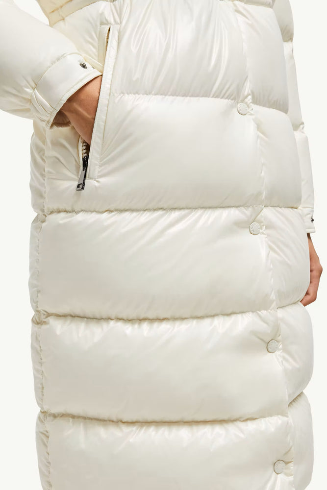 Close-up of a white puffer vest with a reflective surface.Moncler Cavettaz Hooded Long Down Jacket