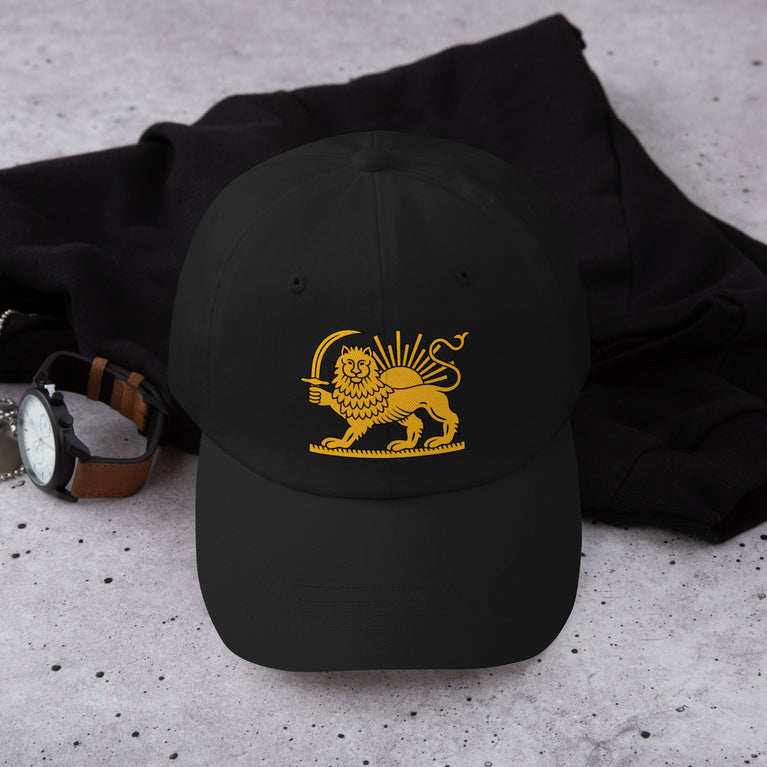 Shiro Khorshid-Lion Sun Persian Hat featuring a lion emblem on a Black cap.