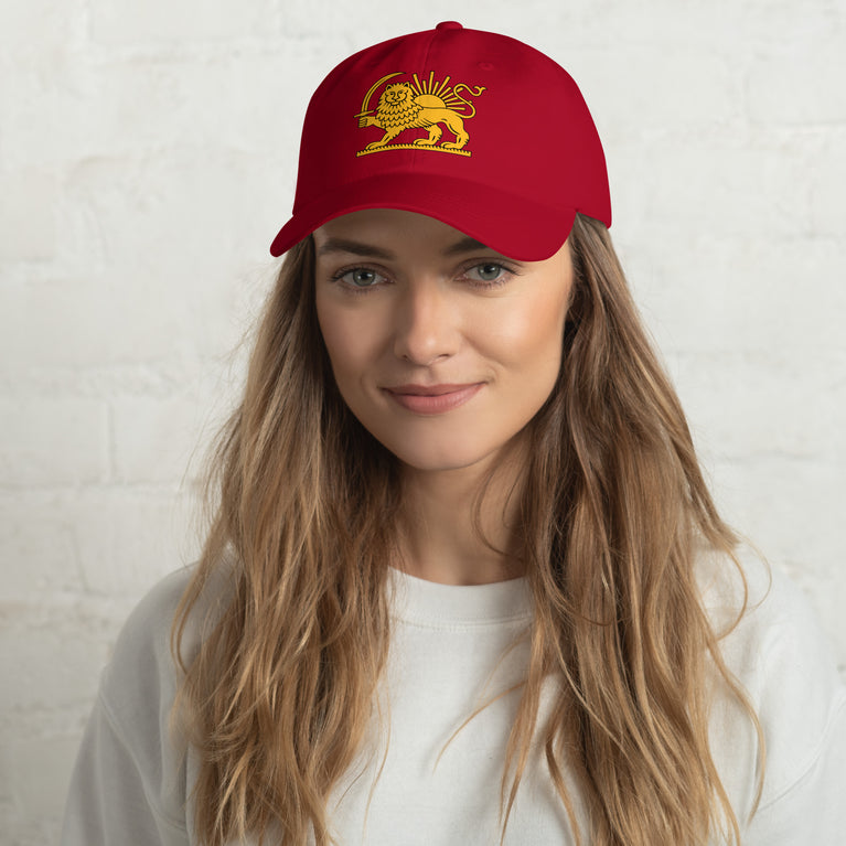 Shiro Khorshid-Lion Sun Persian Hat featuring a lion emblem on a Red cap.