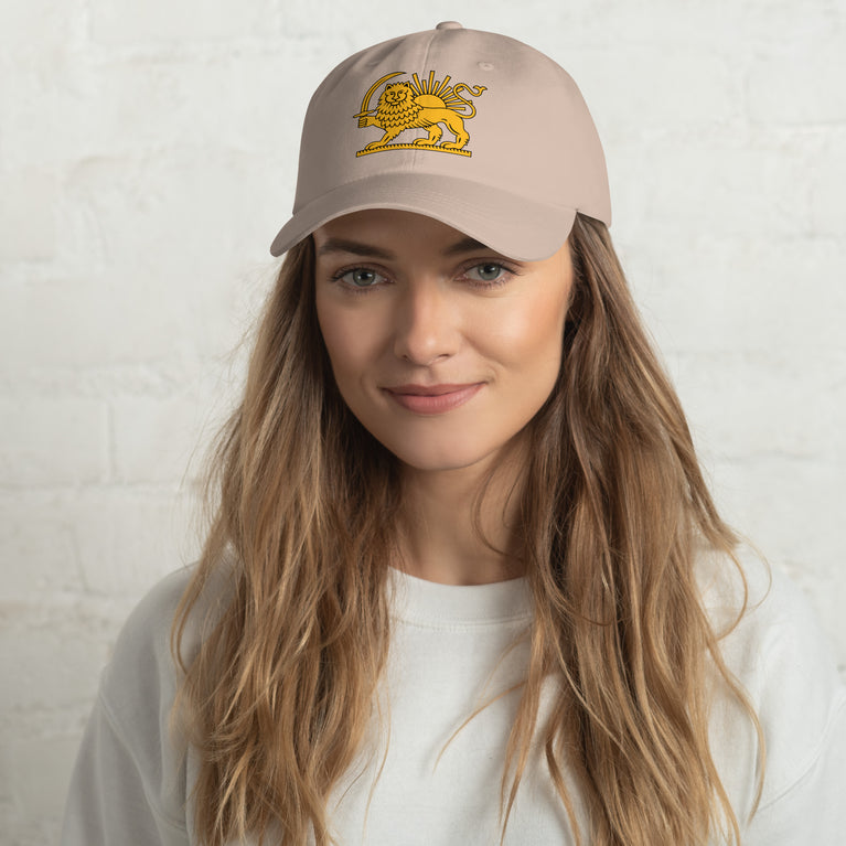Shiro Khorshid-Lion Sun Persian Hat featuring a lion emblem on a Beige cap.