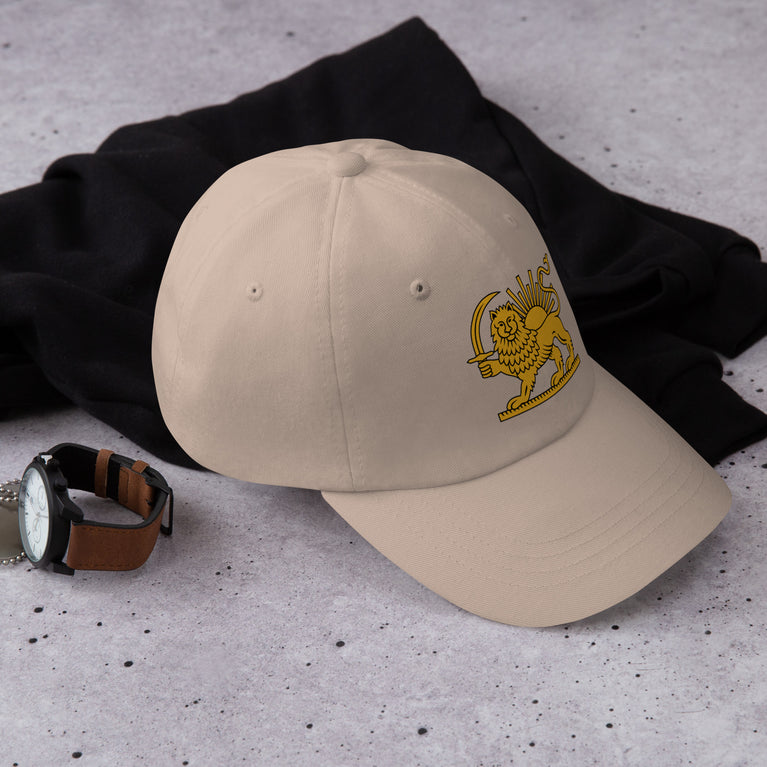 Shiro Khorshid-Lion Sun Persian Hat featuring a lion emblem on a Beige cap.