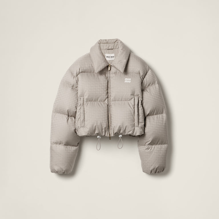 MIUMIU Gray puffer jacket with brand logo on a light gray background