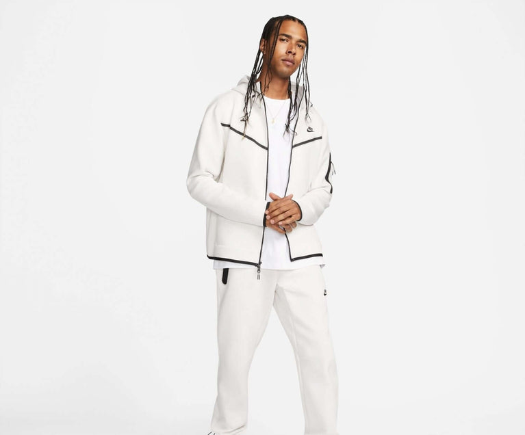 Nike Sportswear Tech Fleece Hoodie & Joggers Set White worn by a model, showcasing modern sportswear style.