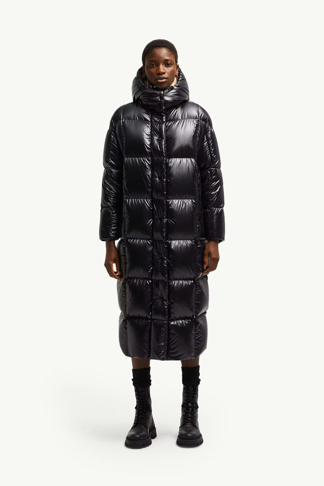 Person wearing a long black puffer coat, Moncler Cavettaz Hooded Long Down Jacket