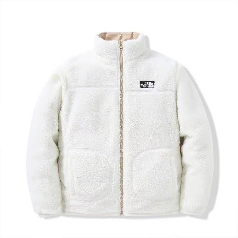 The NorthFace Two Sided Coat for Women and Men. White fleece jacket with a brand logo on a white background