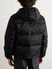 Man wearing GUCCI black puffer jacket and black pants